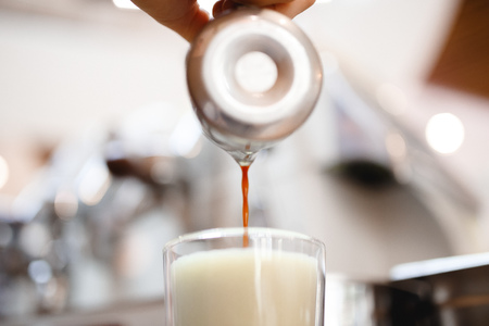 Coffee extraction espresso from professional machine and barista with filterの写真素材