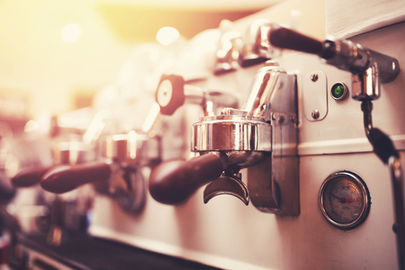 Coffee extraction espresso from professional machine and barista with filterの写真素材