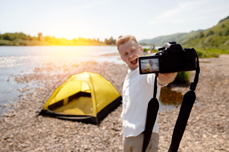 Blogger photographer recorder Selfie video travel about travel, freedom. Concept lifestyle tripの写真素材