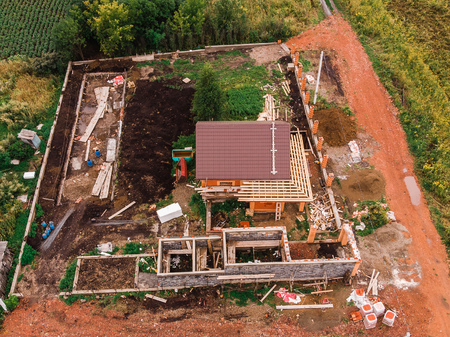Construction work building house made of wood, tiled roof. aerial view dronの写真素材