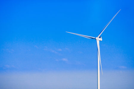Wind turbines generating electricity. Concept alternative energy. Blue skyの写真素材