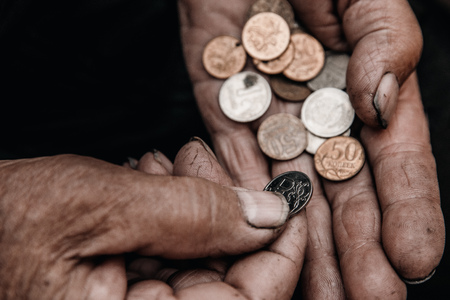 Concept poverty in Russia, people of CIS, USSR. Old hands hold rubleの写真素材