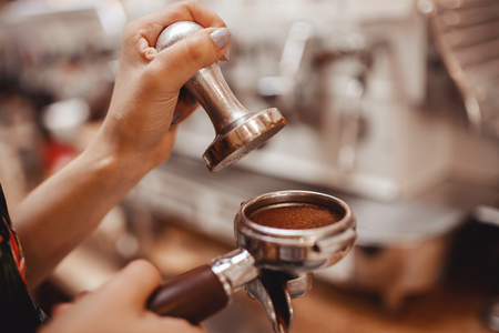 Close-up prepares espresso in coffee shop baristaの写真素材