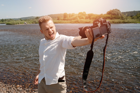 Blogger photographer recorder Selfie video travel about travel, freedom. Concept lifestyle tripの写真素材