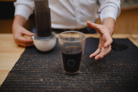 Barista man Making coffee in airpress service.の写真素材