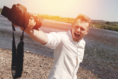 Blogger photographer recorder Selfie video travel about travel, freedom. Concept lifestyle tripの写真素材