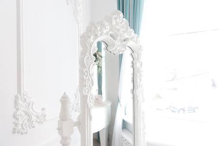 Boudoir table. Details of interior bedroom for girls and make-up, hairstyles with mirrorの写真素材