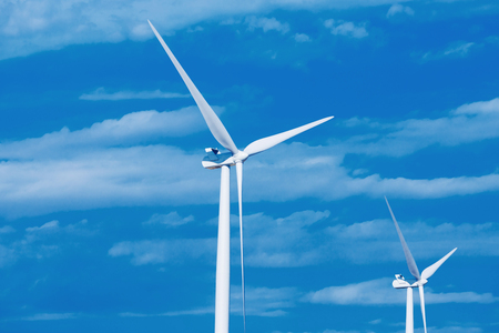 Wind turbines generating electricity. Concept alternative energy. Blue skyの写真素材