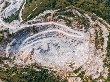 Aerial view drone Open pit mine, digging for gold, minerals, iron ore, marble extractive industryの写真素材