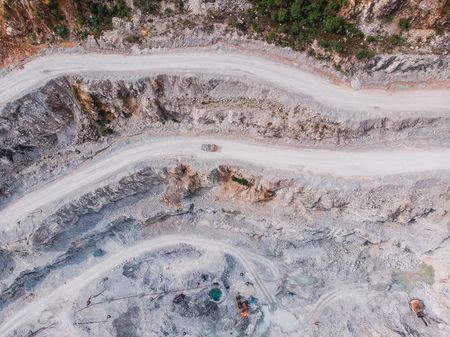 Open pit mine, digging for gold, minerals, iron ore, marble extractive industryの写真素材