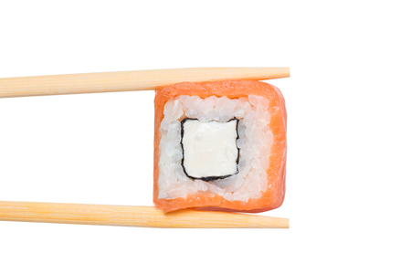 Japanese food eating california roll sushi on white isolated background hold Wooden sticks.の写真素材