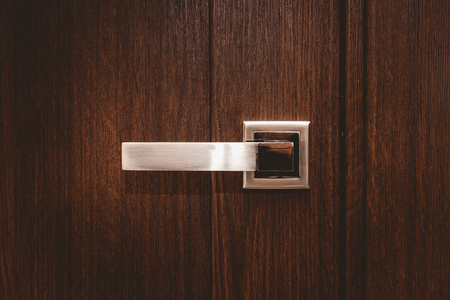 Part brown wooden door with handle modernの写真素材