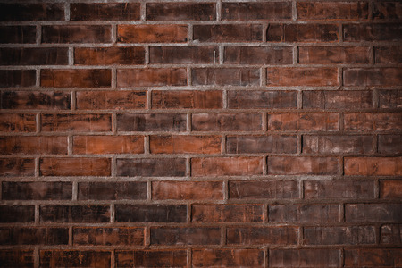 Old red brick wall vintage grunge backgroundの写真素材