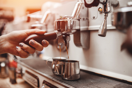 Barista Coffee machine makes two cups italian espressoの写真素材