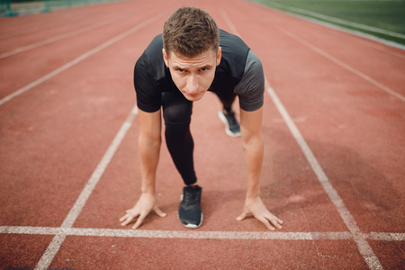 Athlete view of runner man on treadmill is ready to win.の写真素材