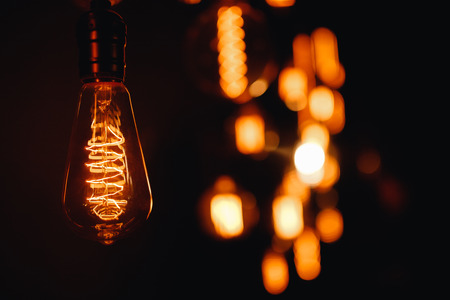 Set edison retro lamp on loft gray concrete black background.の写真素材