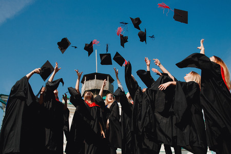 TOMSK, RUSSIA - September 8, 2018: Graduates students in university robes celebrate end of academic year Bachelor and Master programs.のeditorial素材
