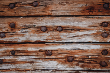Background is old dark wooden from ship and rusty nails.の写真素材
