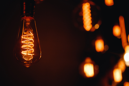 Set edison retro lamp on loft gray concrete black background.の写真素材