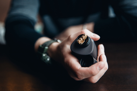 vaping man holding a mod. concept of refusal of tobacco. Vapingの写真素材