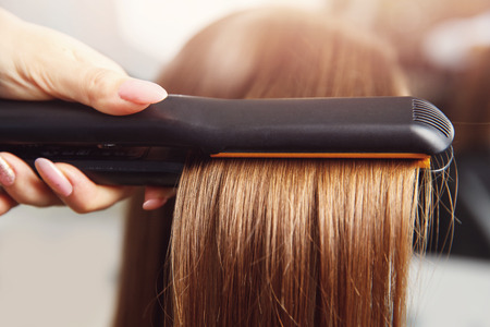 Hair iron straightening beauty care salon spa.の写真素材