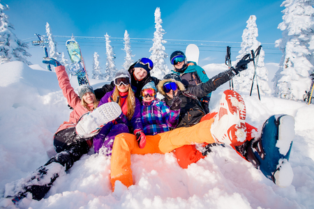 Sheregesh, Kemerovo region, Russia - November 17, 2018: Group of merry people with skis and snowboards playのeditorial素材