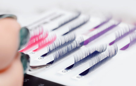 Eyelashes tool extension. Master of tweezers is working.