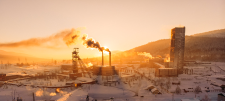 Winter pollution smoke industrial buildings sunset aerial droneの写真素材
