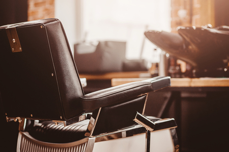 Barbershop armchair. Modern hairdresser and hair salon, barber shop for menの写真素材