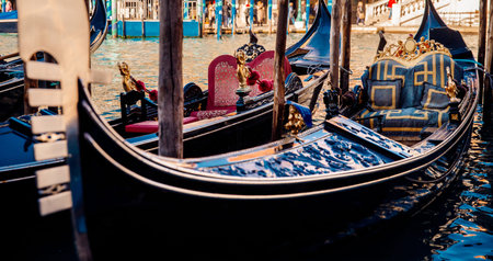 Details of gondola boat closeup parked on water. Venice, Italy.の写真素材