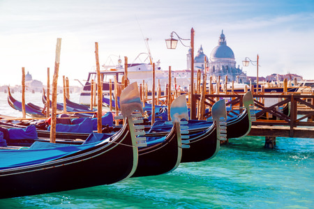 Canal with gondolas in Venice, Italy. Sunny day. Concept of romantic travel.の写真素材