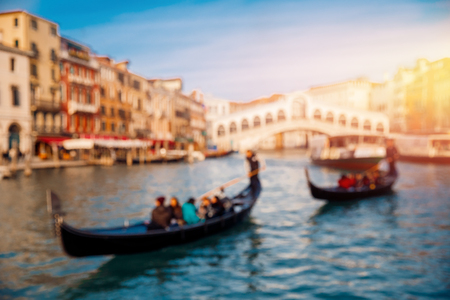 Blurred background Venice, Italy, gondolier carries tourists by boat along the canal. Concept travel.の写真素材