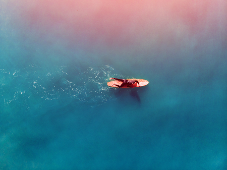 Surfer wave in ocean, top view aerial photo, tropical water, Glare of lightの写真素材