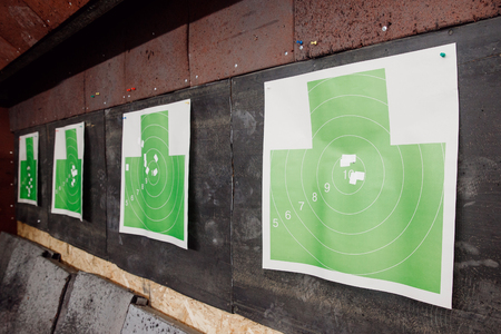 Shooting range gun. Paper target in white and green color for hit.の写真素材