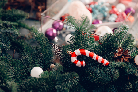 Woman decorating coniferous wreat Christmas tree workshop DIY.の写真素材