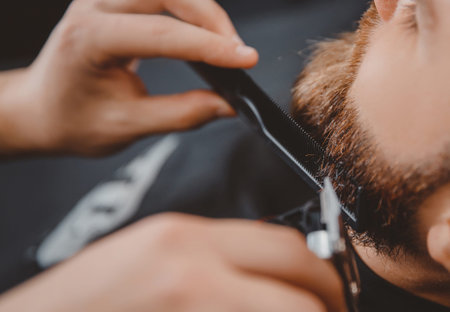 Man hipster having barber shave barbershop scissors.