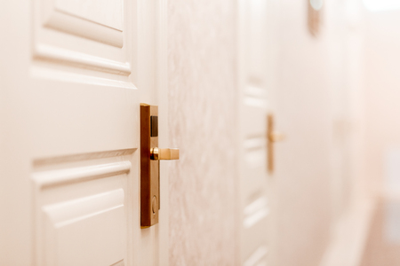 Corridor door hotel with automatic lock for visitor card. White tone.の写真素材