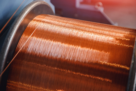 Production of copper wire, bronze cable in reels at factory.の写真素材
