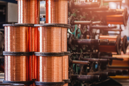 Production of copper wire, bronze cable in reels at factory.の写真素材