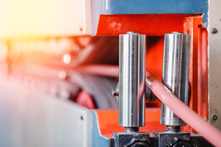 Production line conveyor roller, moved by automatic tape.の写真素材