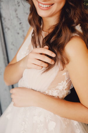 Closeup of white lace wedding dress for girlの写真素材
