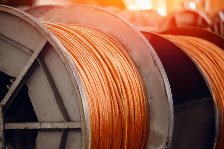 Production of copper wire, bronze cable in reels at factory.の写真素材