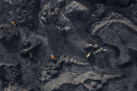 Open pit mine, extractive industry for coal, top view aerial drone.