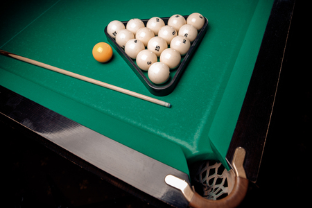 Billiard Russian green table and cue with white balls.の写真素材