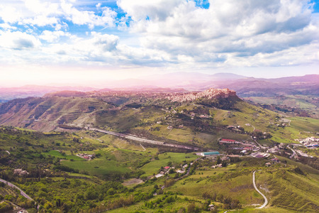 Ancient Calascibetta landscape city on rock, Sicily, Italy. sunset Aerial photo.の写真素材