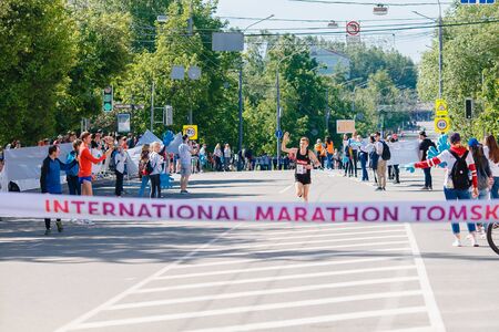 Tomsk, Russia - June 9, 2019: International Marathon Jarche athletes runners crowd are at finishのeditorial素材