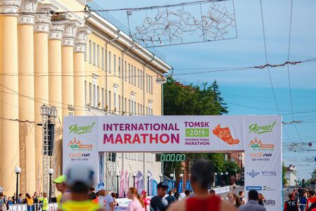 Tomsk, Russia - June 9, 2019: International Marathon Jarche athletes runners crowd are at startのeditorial素材
