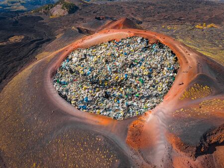 Disposal debris in crater of volcano. Concept recycling waste and plastic by fire and temperatureの写真素材