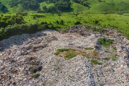 Waste garbage dump household pile trash, aerial top view background. Concept environmental struggle with plastic industryの写真素材