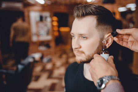 Oil for care and growth of beard, barbershopの写真素材